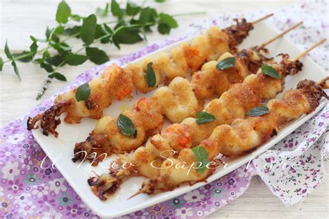 Spiedini di gamberi e calamari gratinati al forno